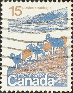 Close up of Canada stamps featuring landscape with bighorn sheep. 